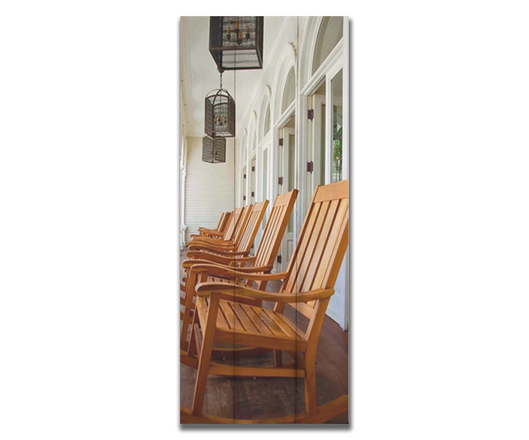 A photo looking down a row of rocking chairs on a porch in O'ahu, Hawaiʻi. Printed on a box board.