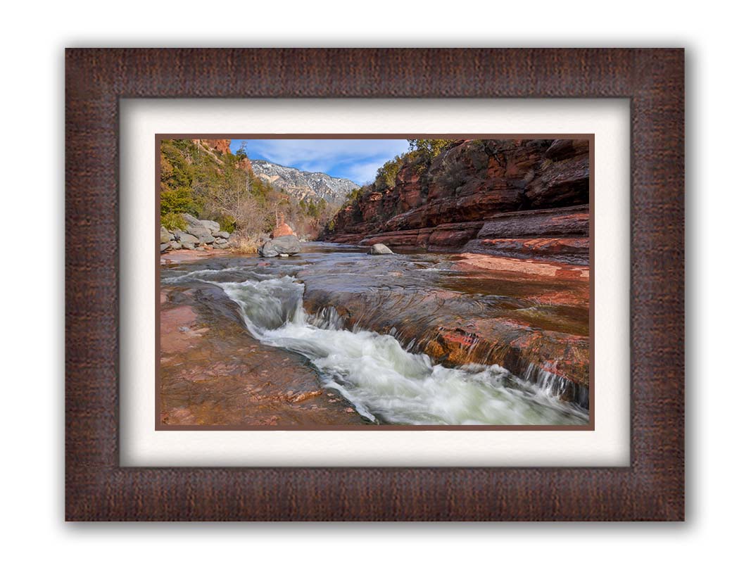 A photo of Slide Rock State Park in Sedona, Arizona, focusing on the iconic Oak Creek "natural waterslide." Printed on paper, matted, and framed.