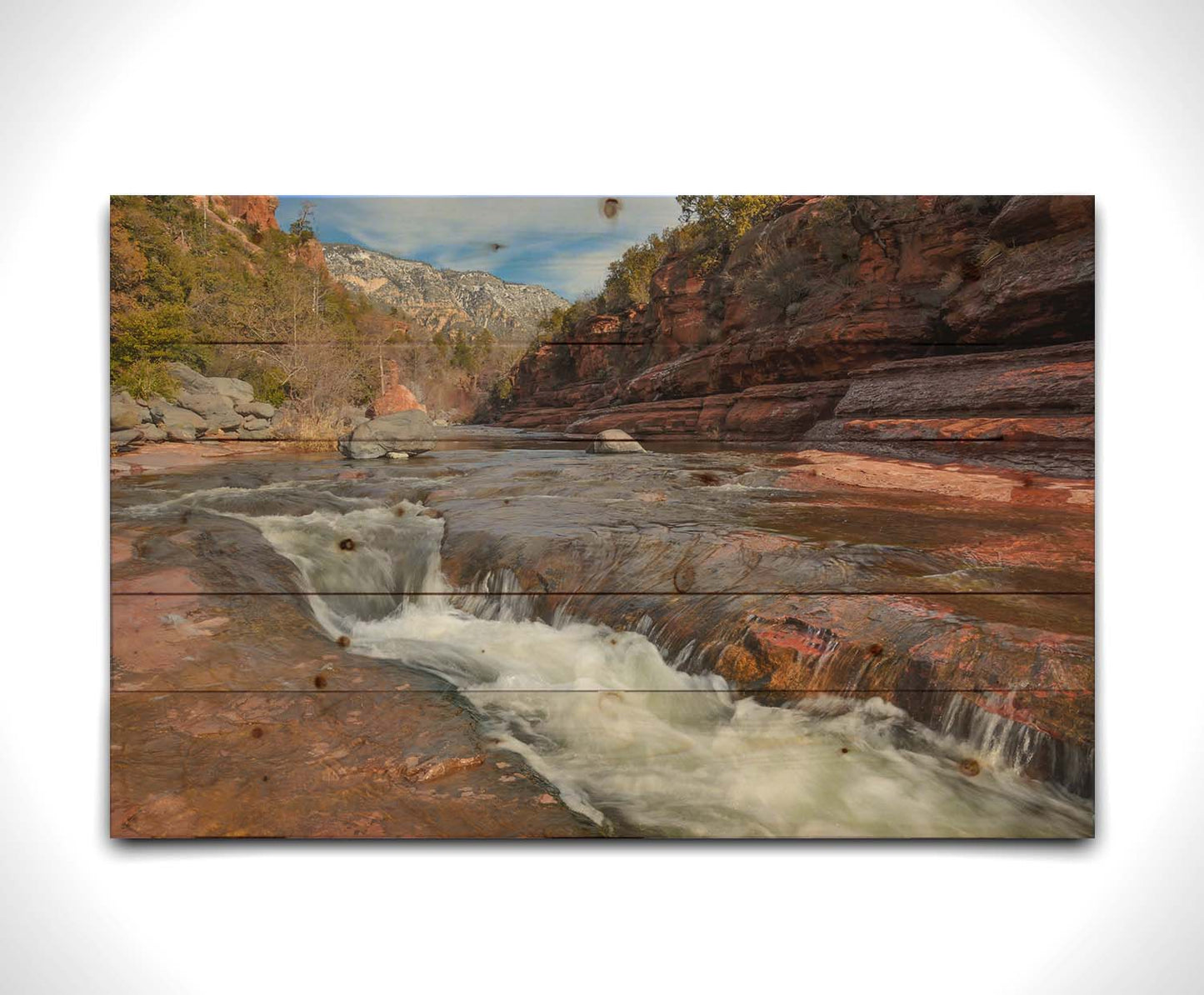 A photo of Slide Rock State Park in Sedona, Arizona, focusing on the iconic Oak Creek "natural waterslide." Printed on a wood pallet.