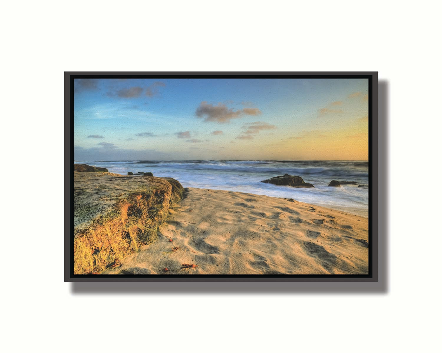 A photo of the Windansea beach at sunset. Printed on canvas in a float frame.