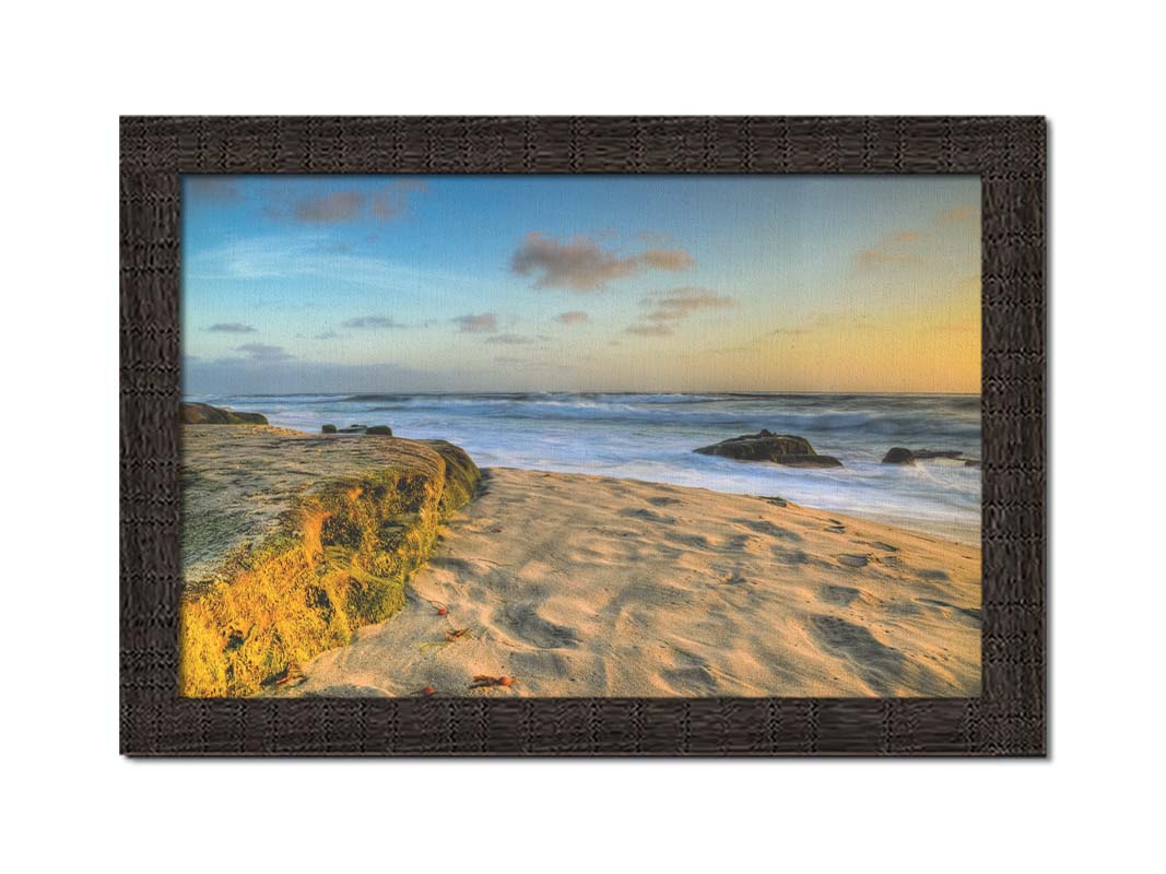 A photo of the Windansea beach at sunset. Printed on canvas and framed.