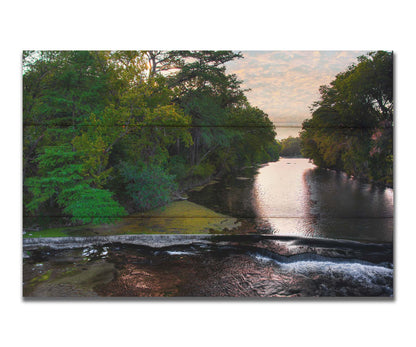 A photograph of the Comal River in New Braunfels, Texas. Printed on a box board.