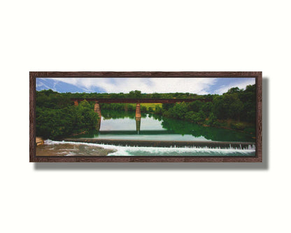 A panoramic photograph of the Faust Street Bridge in Texas, one of the largest remaining 19th century bridges by the King Bridge Company. Printed on canvas in a float frame.