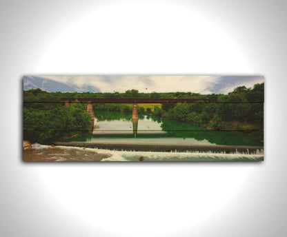 A panoramic photograph of the Faust Street Bridge in Texas, one of the largest remaining 19th century bridges by the King Bridge Company. Printed on a wood pallet.