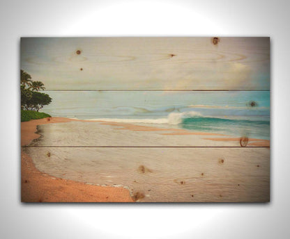 A refreshing photograph of Hawai'i's Ka'anapali beach, with cool blue waves rolling onto shore and mountains in the distance. Printed on a wood pallet.