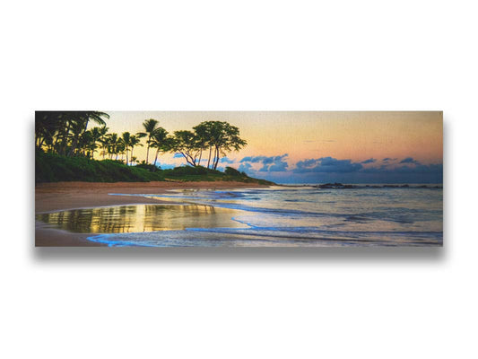 A photo of Keawakapu Beach at sunrise, with palms and mountains in the distance. Printed on canvas.