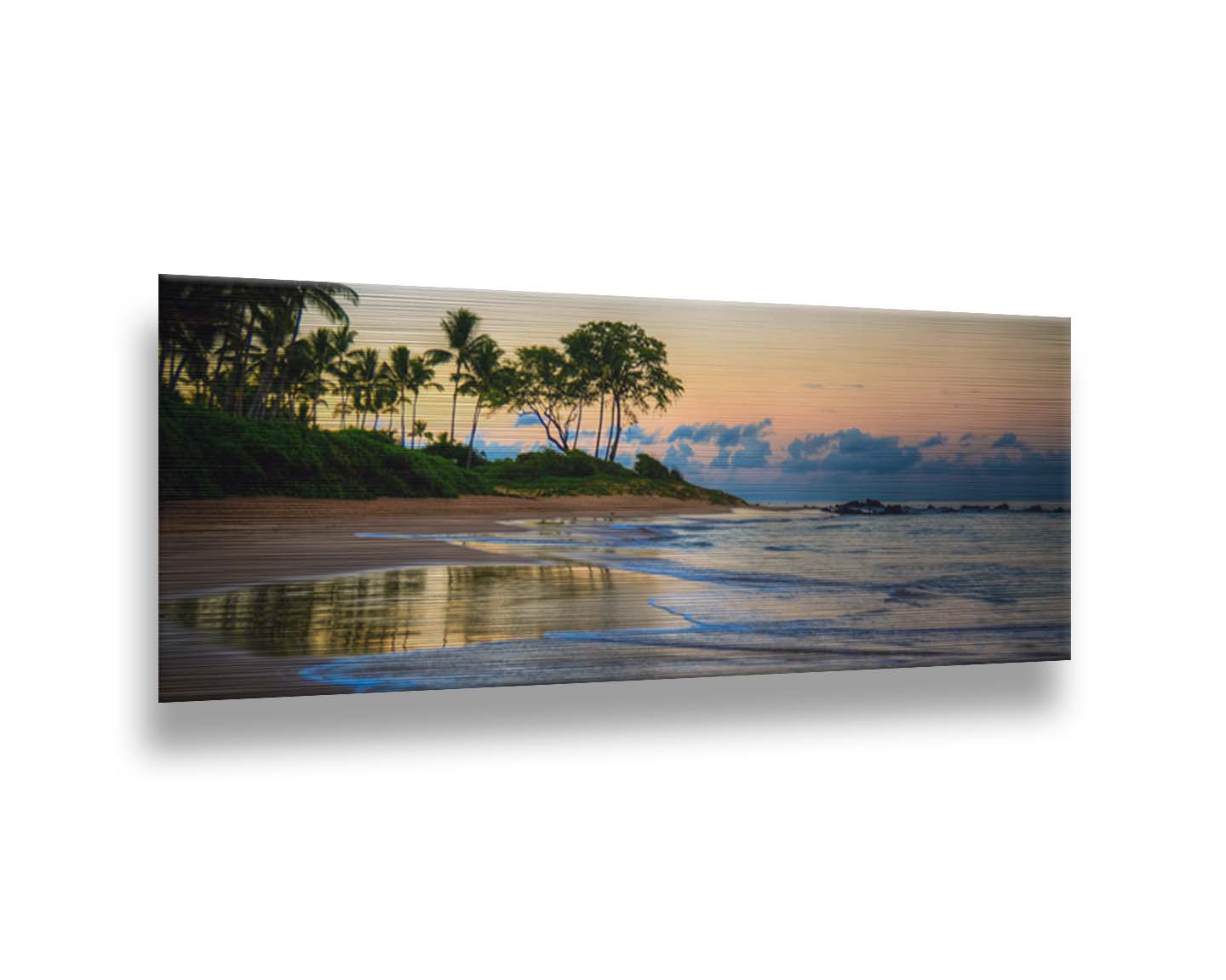 A photo of Keawakapu Beach at sunrise, with palms and mountains in the distance. Printed on metal.