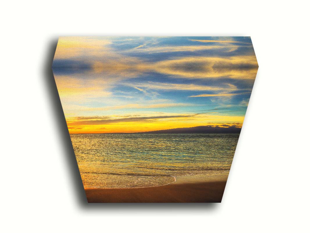 A photograph of a colorful sunset with a majestic mountain on the horizon, looking out over the sea on the coast of Maui, Hawaiʻi. Printed on canvas.