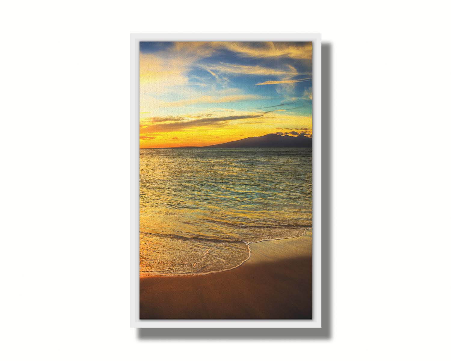 A photograph of a colorful sunset with a majestic mountain on the horizon, looking out over the sea on the coast of Maui, Hawaiʻi. Printed on canvas in a float frame.