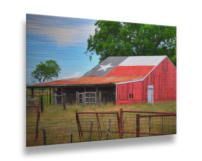 A photograph of a red barn, with a Texas flag painted on the roof. It is surrounded by red ranch fences and grassy fields. Printed on metal.