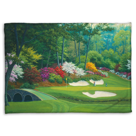 Coral fleece blanket designed with a painting of the Augusta Nationals golf course in Georgia.