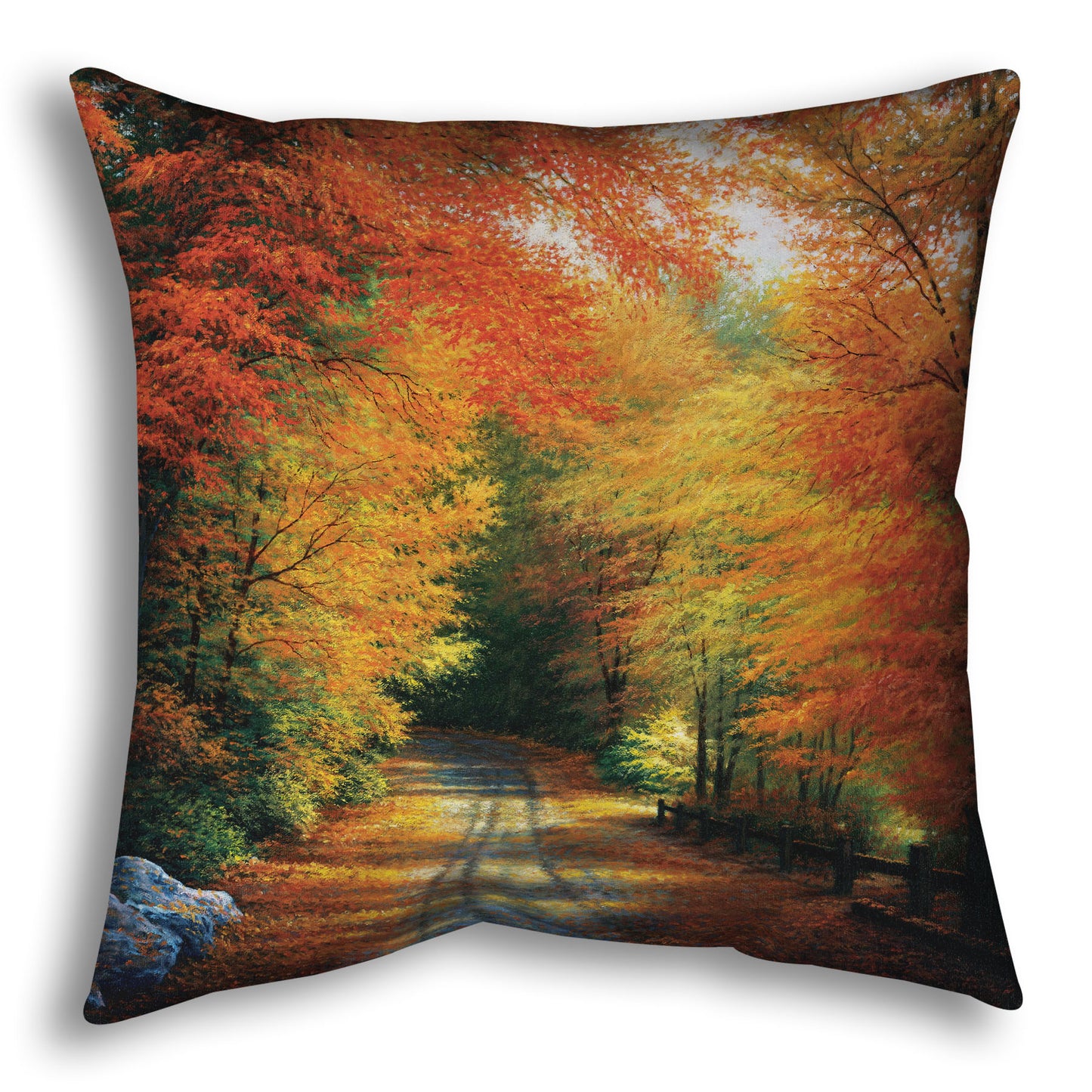 Decorative pillow with a painted autumn forest design. Red, orange, and yellow trees line a road winding through the forest.