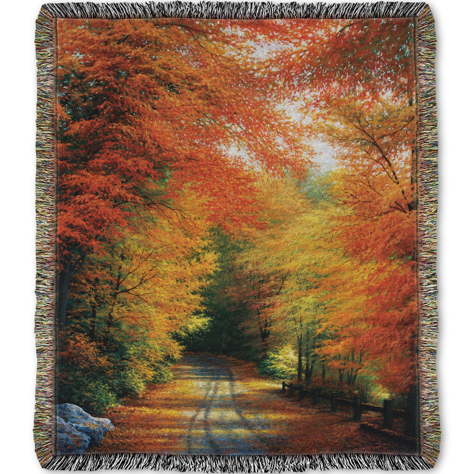 Woven throw blanket with a painted autumn forest design. Red, orange, and yellow trees line a road winding through the forest.