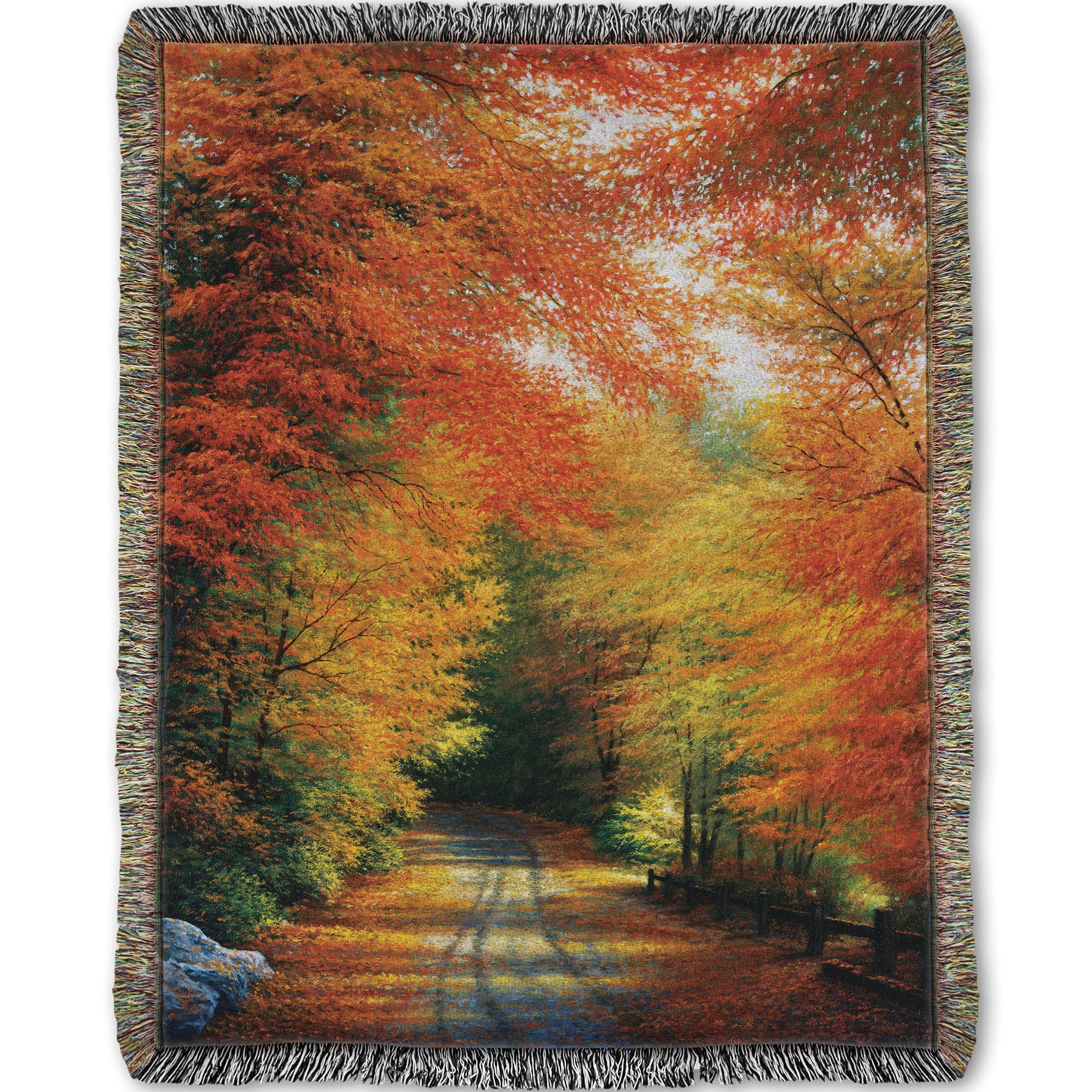 Woven throw blanket with a painted autumn forest design. Red, orange, and yellow trees line a road winding through the forest.