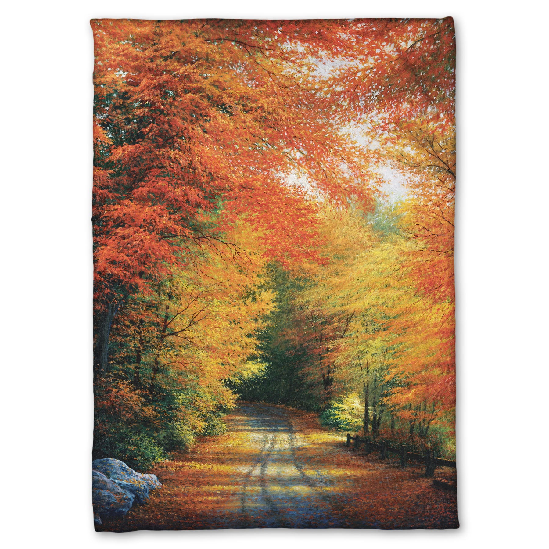 Coral fleece throw blanket with a painted autumn forest design. Red, orange, and yellow trees line a road winding through the forest.