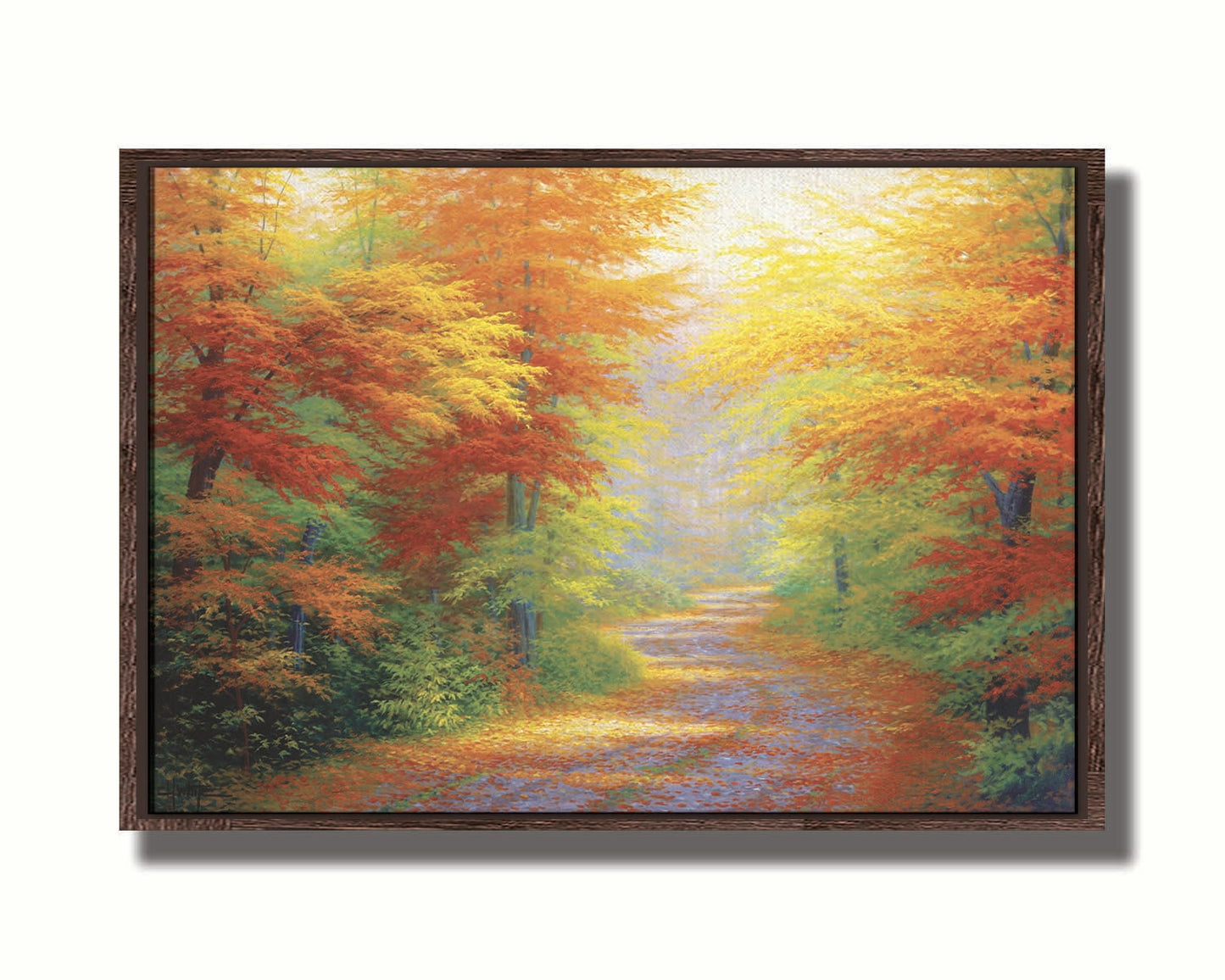 A painting of a road winding through a forest during fall. The green, yellow, red, and orange foliage and trees shed leaves that line the path. Printed on canvas in a float frame.