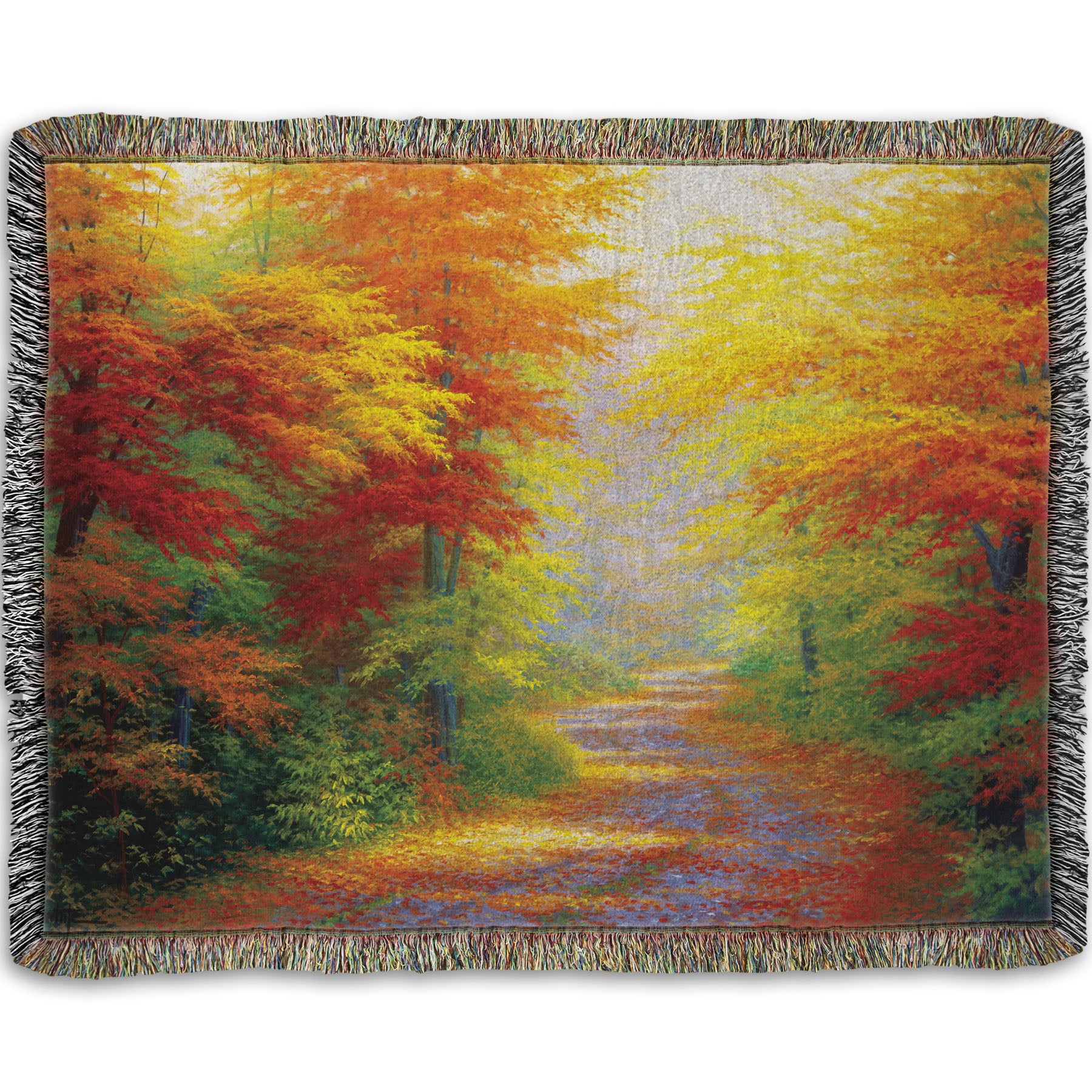 A woven throw blanket designed with a painting of a road winding through a forest during fall. The green, yellow, red, and orange foliage and trees shed leaves that line the path.