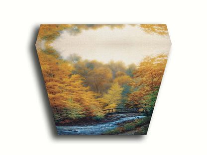 A painting of a forest stream, passing under an arched bridge. The trees are changing to yellow and orange for the fall season. Printed on canvas.