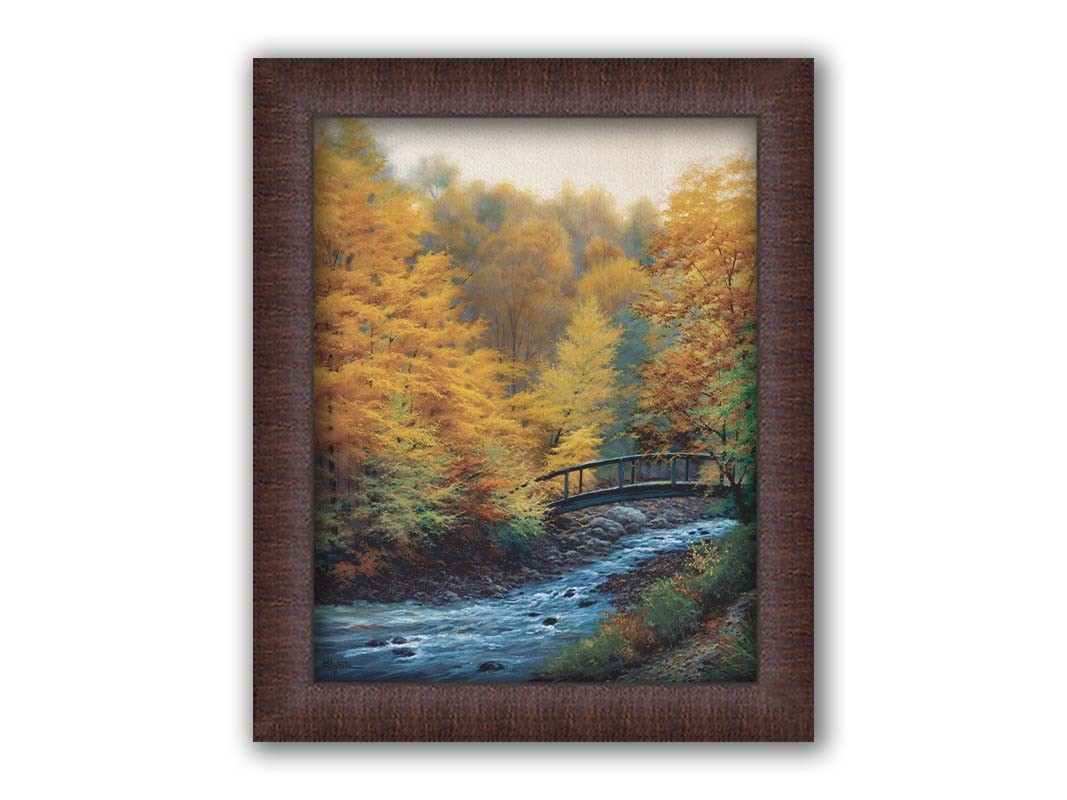 A painting of a forest stream, passing under an arched bridge. The trees are changing to yellow and orange for the fall season. Printed on canvas and framed.