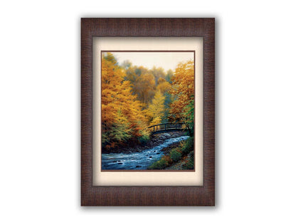 A painting of a forest stream, passing under an arched bridge. The trees are changing to yellow and orange for the fall season. Printed on paper, matted, and framed.