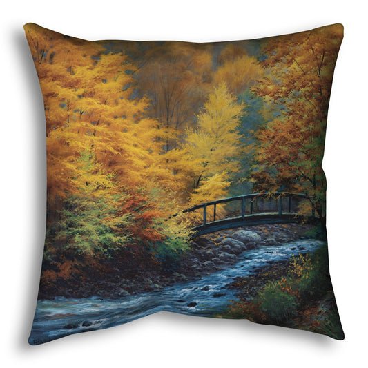 Throw pillow designed with a painting of a forest stream, passing under an arched bridge. The trees are changing to yellow and orange for fall.