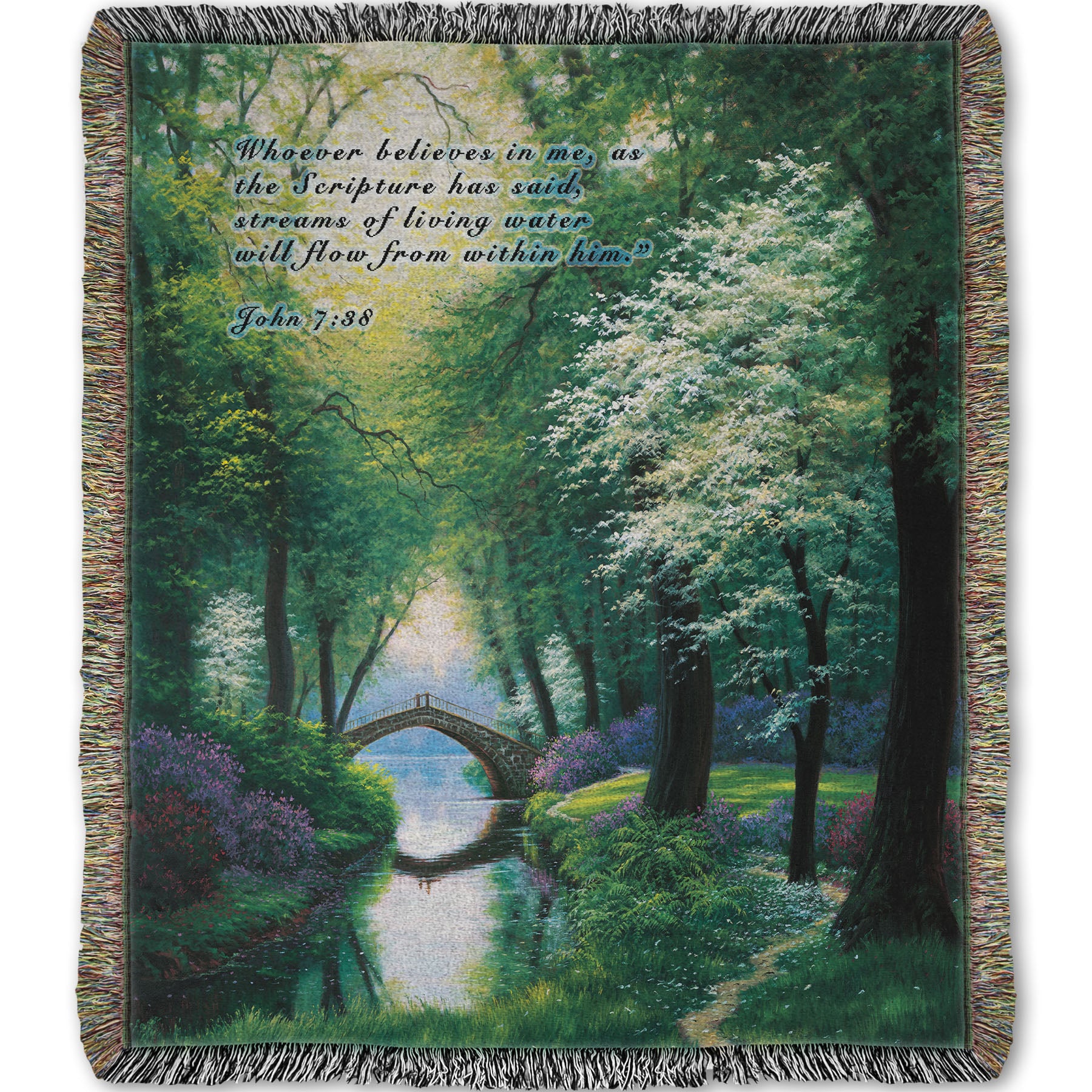 Woven throw blanket designed with a painting of a stream through a lush green forest trail, with a bridge crossing in the distance.