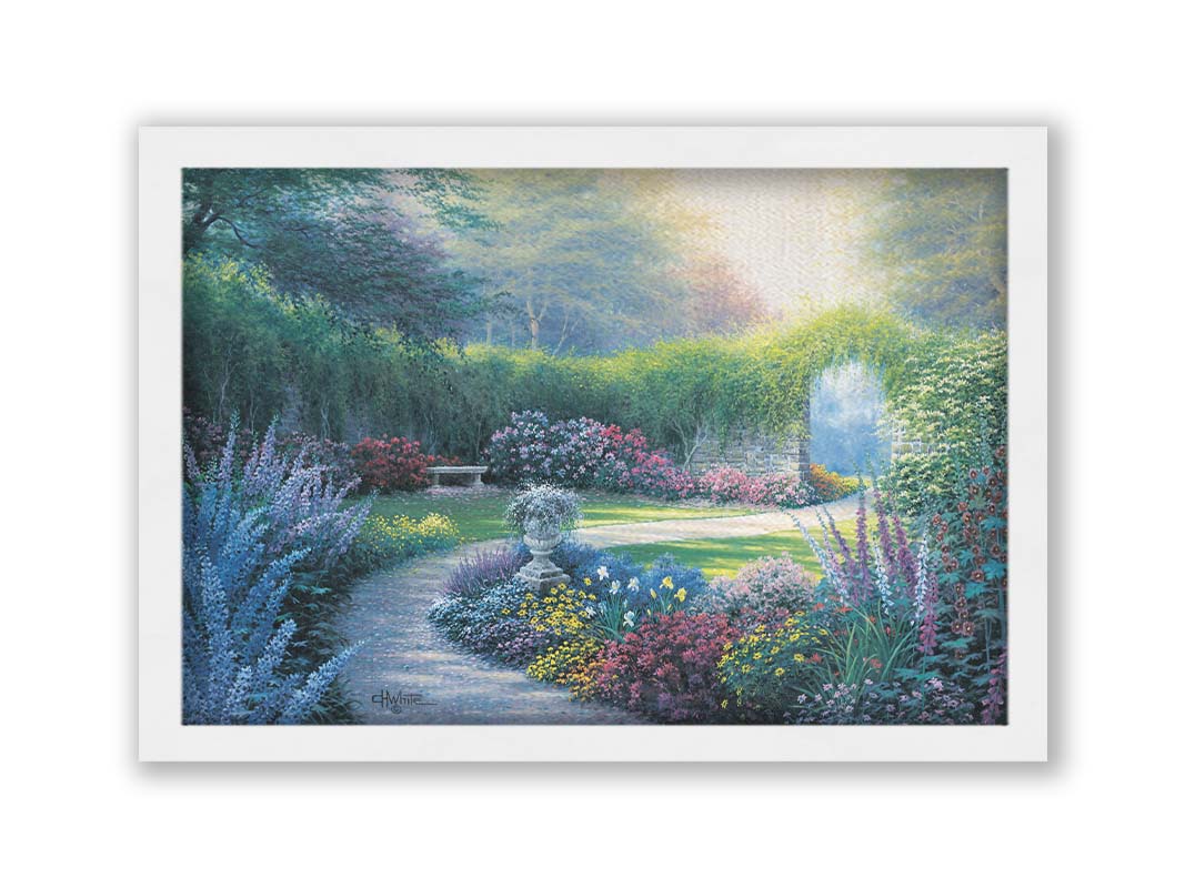 A painting of a serene path through a garden filled with bushes of flowers bathed in a gentle light. Printed on canvas and framed.