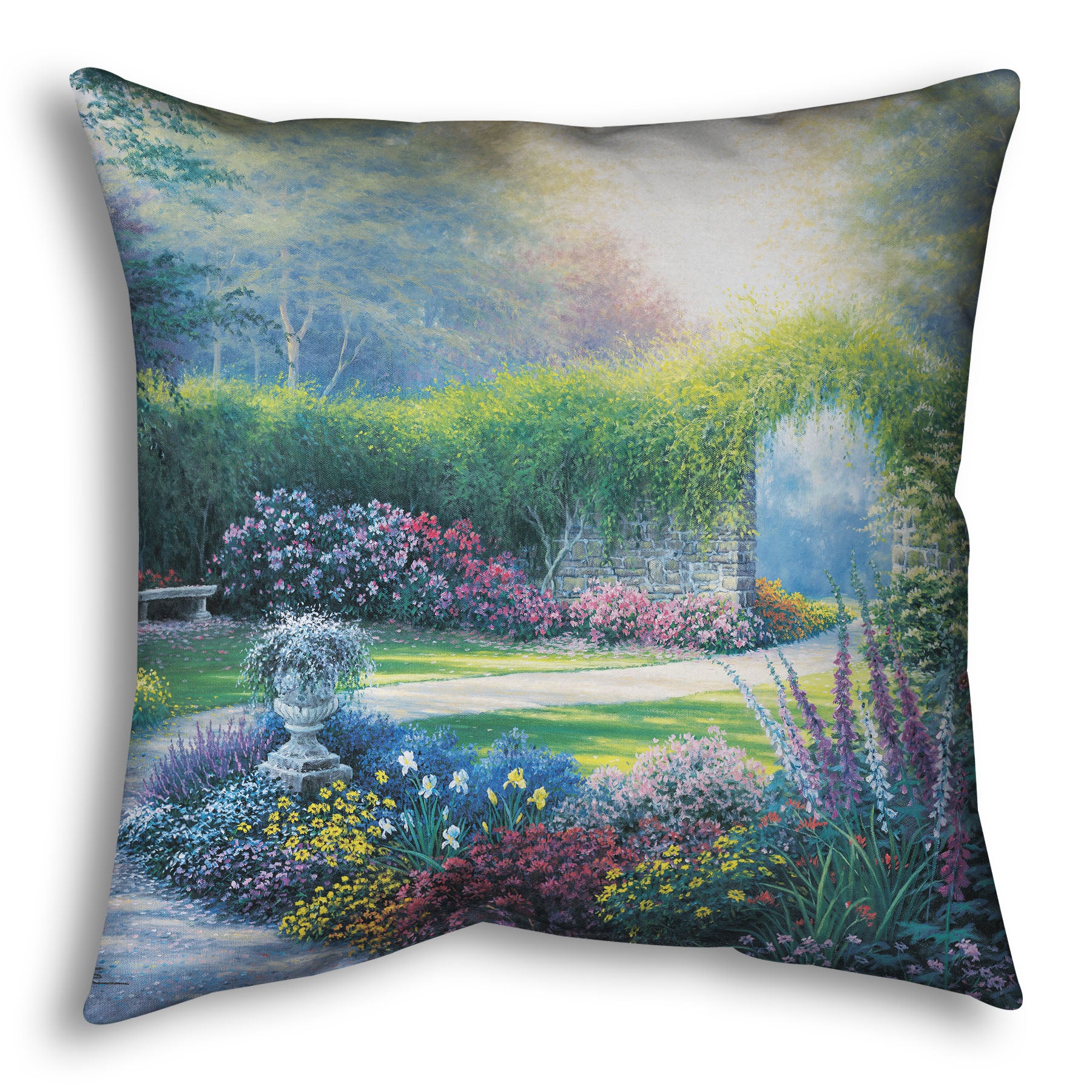 A throw pillow designed with a painting of a serene path through a garden filled with bushes of flowers bathed in a gentle light.