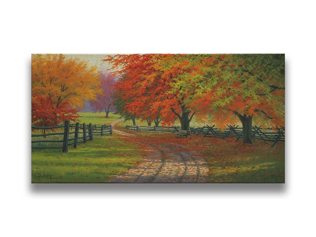 A painting of a road winding through a fenched field, surrounded by multicolor fall maple trees. Printed on canvas.