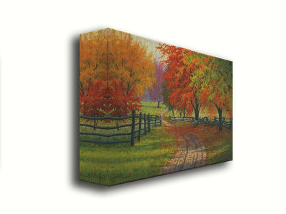 A painting of a road winding through a fenched field, surrounded by multicolor fall maple trees. Printed on canvas.