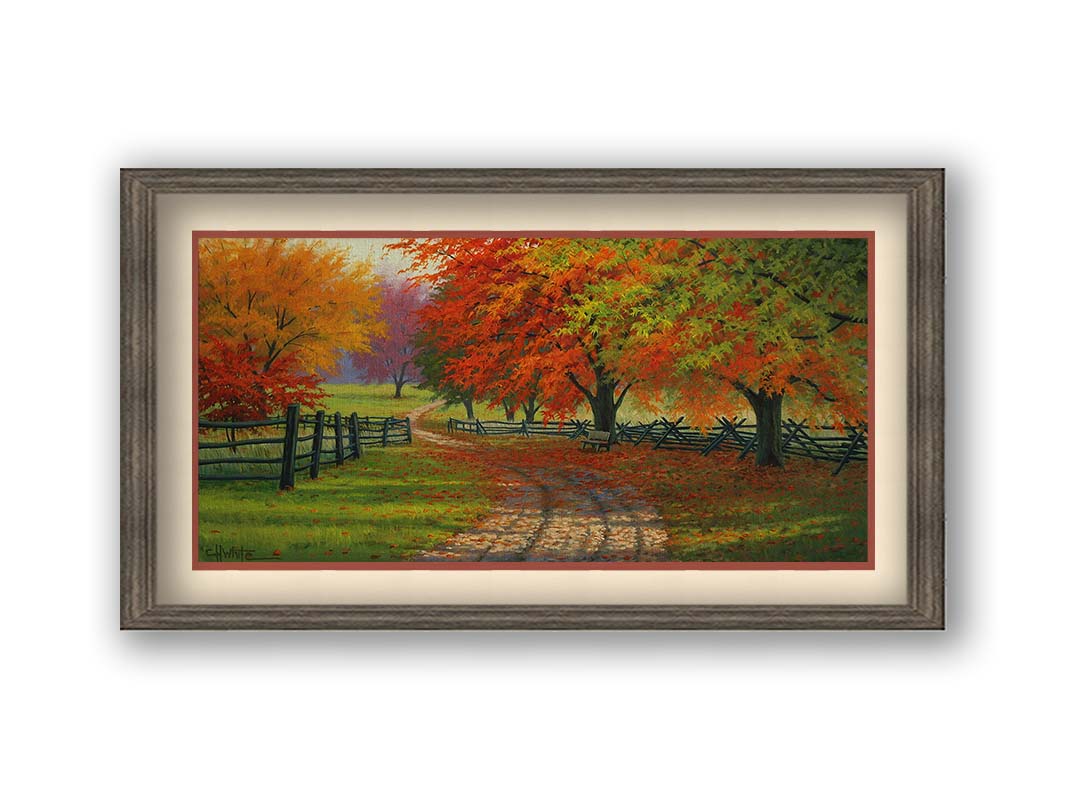 A painting of a road winding through a fenched field, surrounded by multicolor fall maple trees. Printed on paper, matted, and framed.