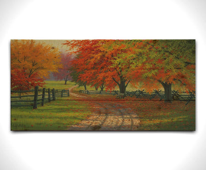 A painting of a road winding through a fenched field, surrounded by multicolor fall maple trees. Printed on a wood pallet.