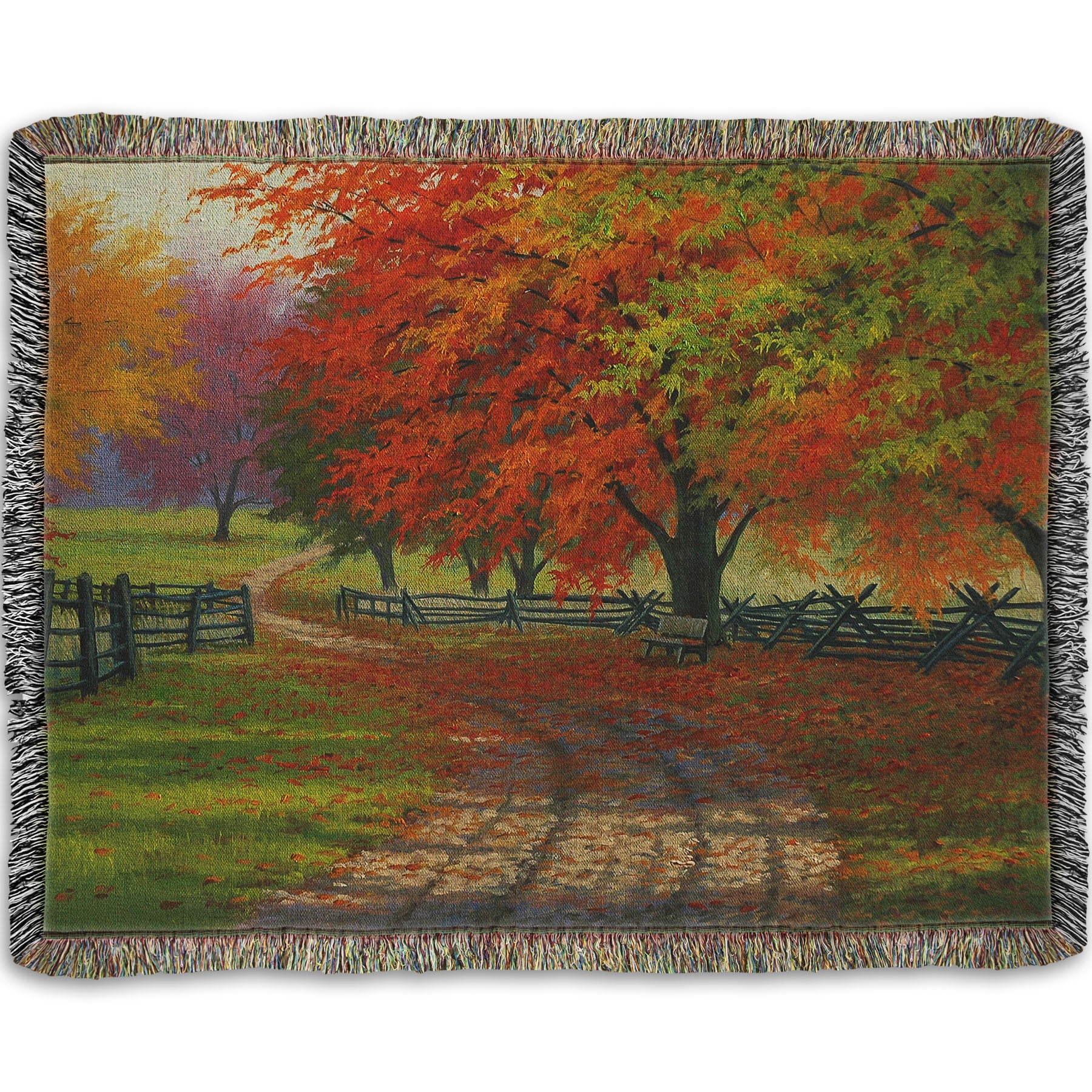 A woven throw blanket designed with a painting of a road winding through a fenced field, surrounded by multicolored fall maple trees.