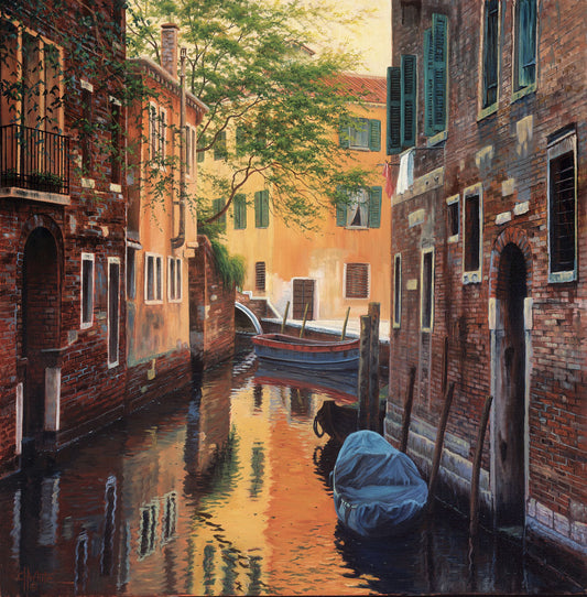 A painting of a canal alleyway between old brick buildings in Venice, Italy, during the day. The buildings reflect off the water in which a few small wood boats float.
