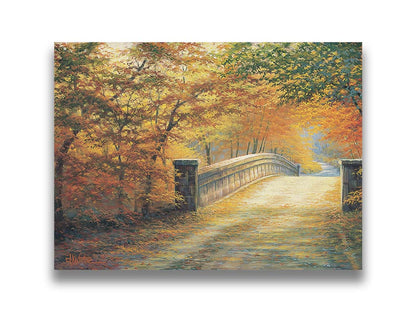 A painting looking down a bridge road during fall. The trees lining the road have turned yellow and orange for autumn, and some of their fallen leaves are scatted along the path. Printed on canvas.