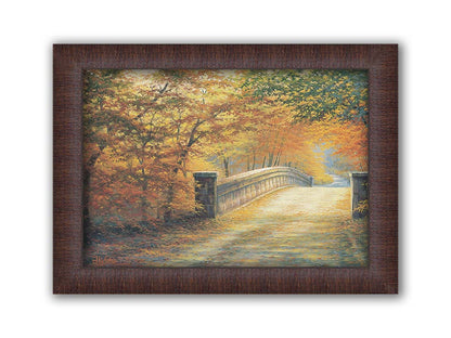 A painting looking down a bridge road during fall. The trees lining the road have turned yellow and orange for autumn, and some of their fallen leaves are scatted along the path. Printed on canvas and framed.