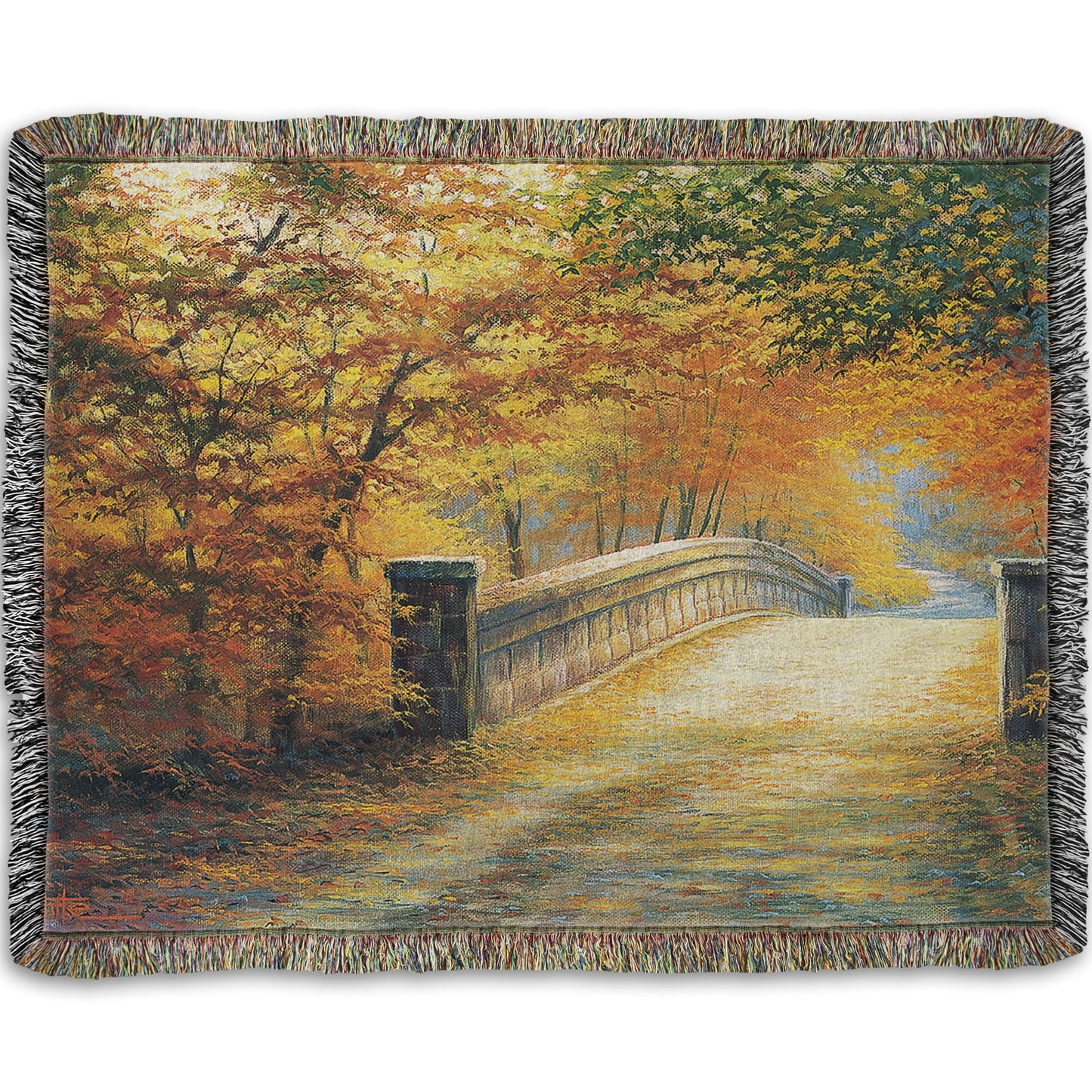 A woven throw blanket designed with a painting looking down a bridge road during fall. The trees lining the road have turned yellow and orange for autumn, and some of their fallen leaves are scatted along the path.