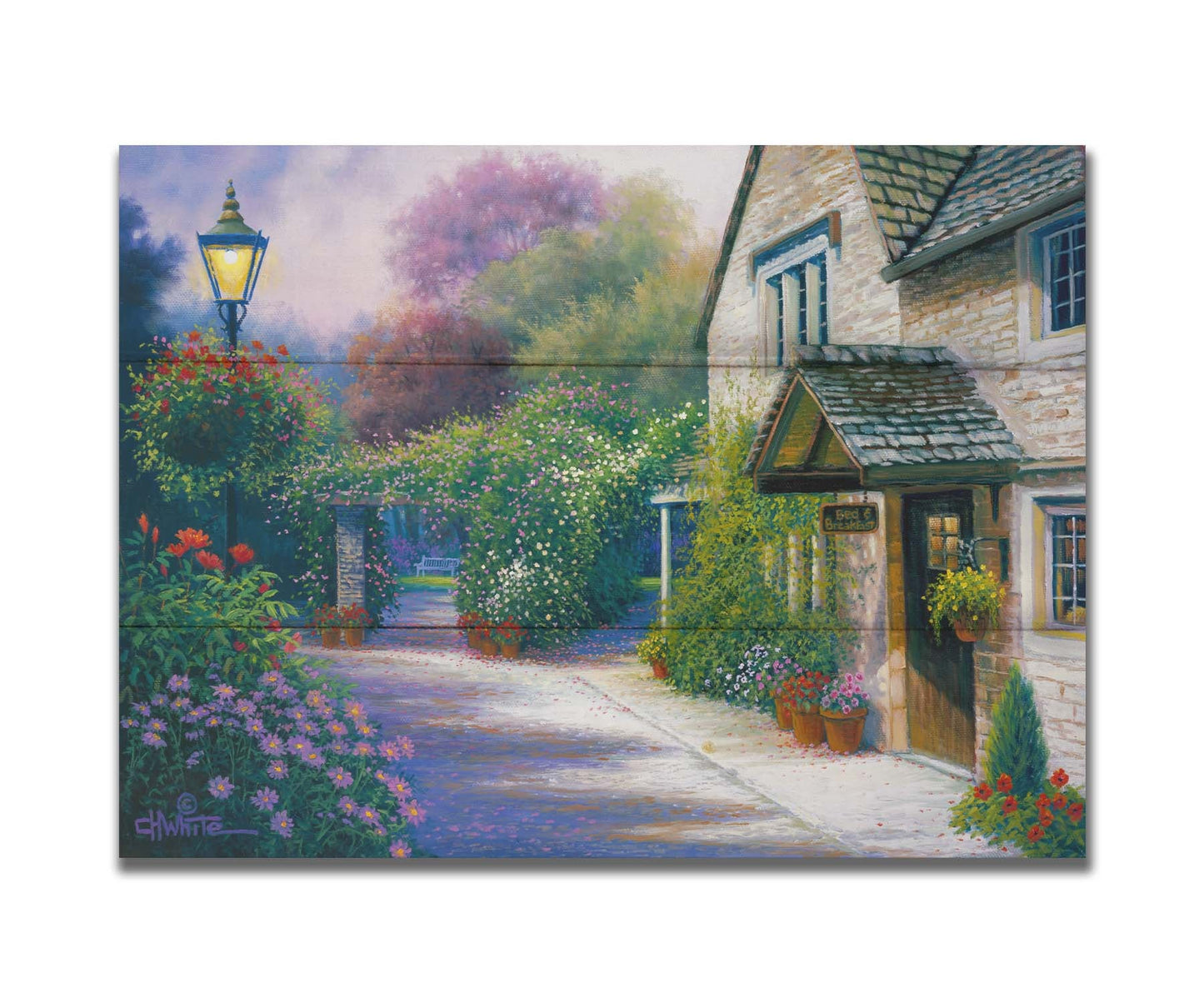 A painting of a bed and breakfast storefront, with a streetlamp-lined path leading to the garden full of blooming flowers. Printed on a box board.