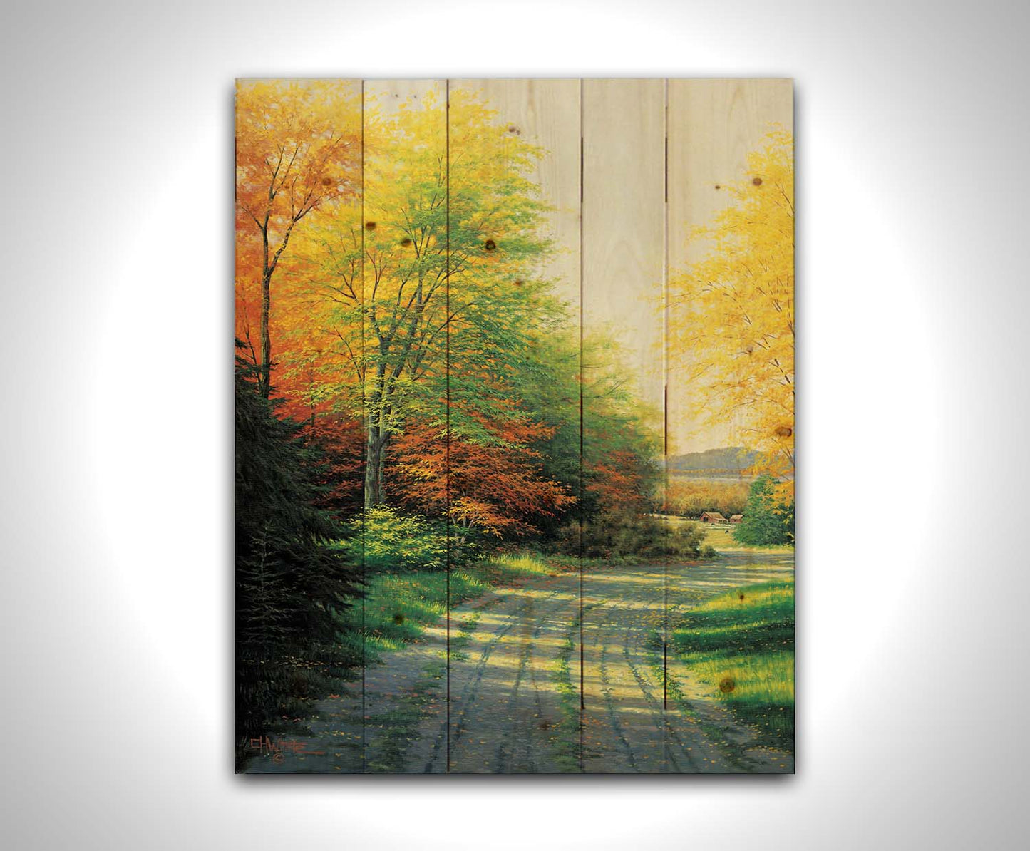 A painting looking down a country road, lined with both deciduous and coniferous trees. Several of the trees' leaves have turned orange and yellow due to the fall season. Printed on a wood pallet.