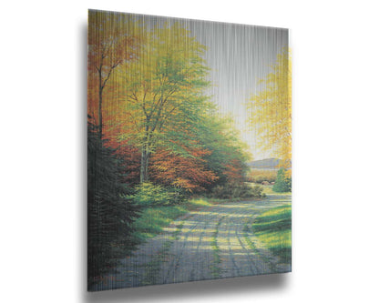 A painting looking down a country road, lined with both deciduous and coniferous trees. Several of the trees' leaves have turned orange and yellow due to the fall season. Printed on metal.