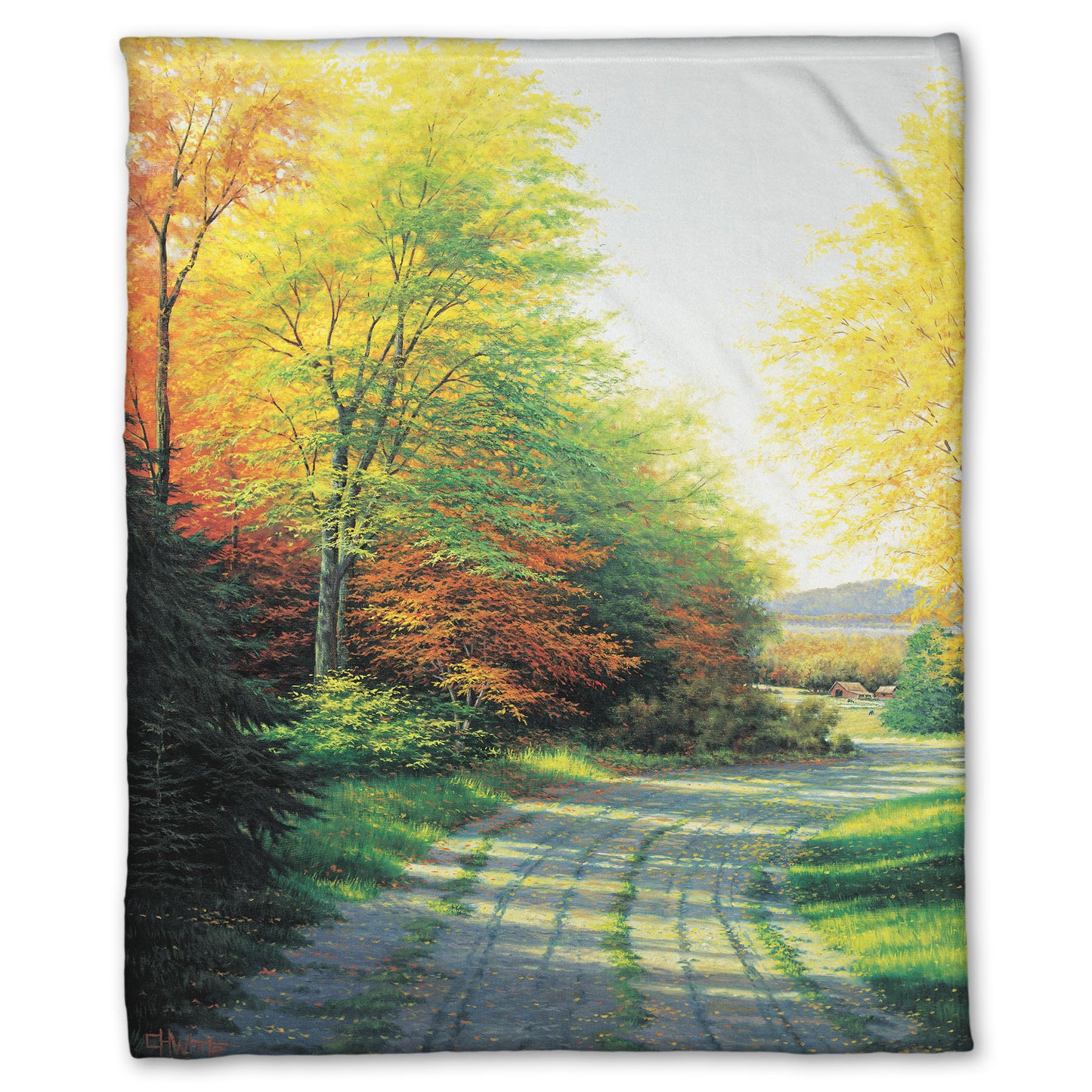 A fleece throw blanket designed with a painting looking down a country road, lined with both deciduous and coniferous trees. Several of the trees' leaves have turned orange and yellow due to fall.
