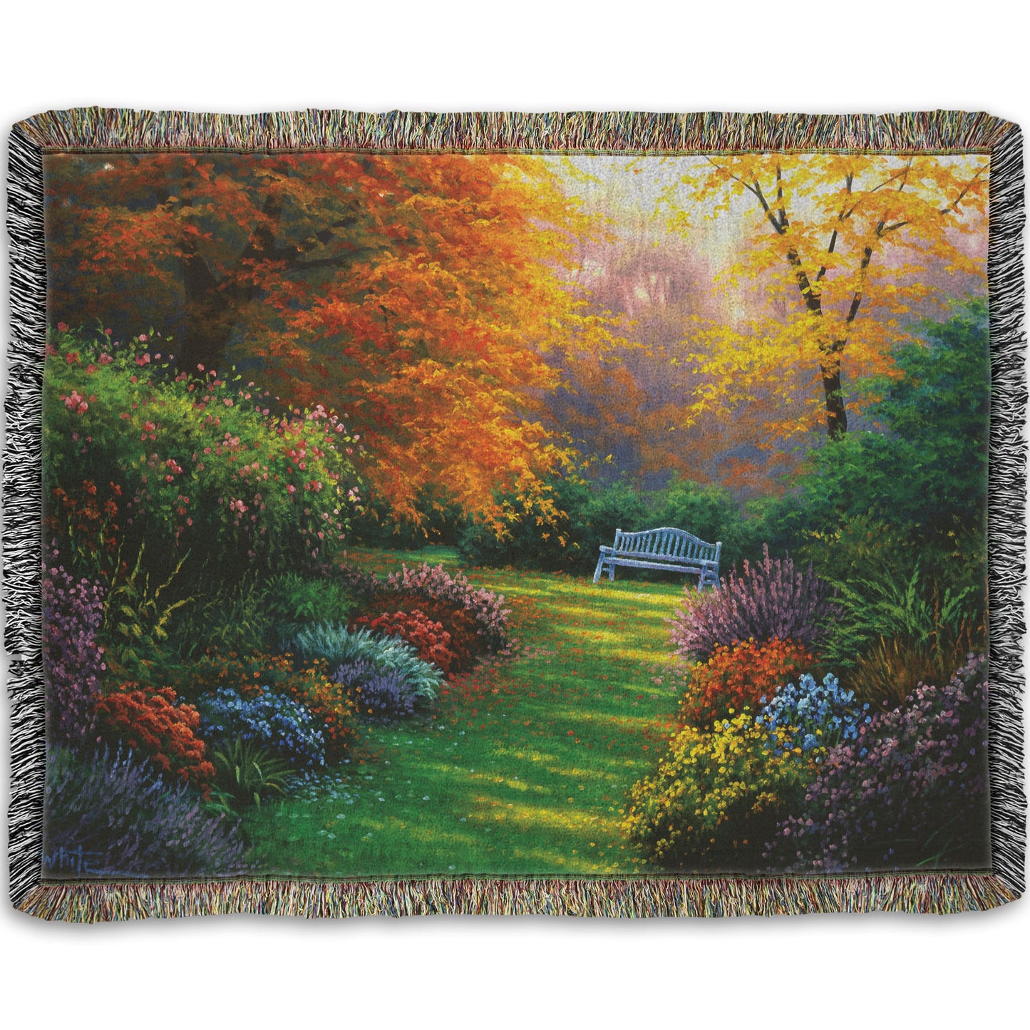 A woven throw blanket designed with a painting of a garden path during fall. The trees surrounding the garden have turned orange and yellow. A grassy path through the garden is surrounded by bushes of flowers in every color, and a bench can be seen up ahead.