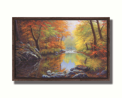 A painting of a river through a forest in autumn, surrounded by red, orange, and yellow trees reflecting on the water. Printed on canvas in a float frame.