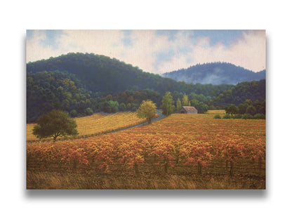 A painting of expansive vineyard fields, turned yellow, red, and orange for the fall. Rolling hills of forests fill the background. Printed on canvas.