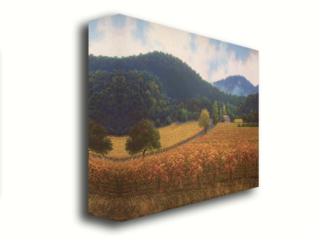 A painting of expansive vineyard fields, turned yellow, red, and orange for the fall. Rolling hills of forests fill the background. Printed on canvas.