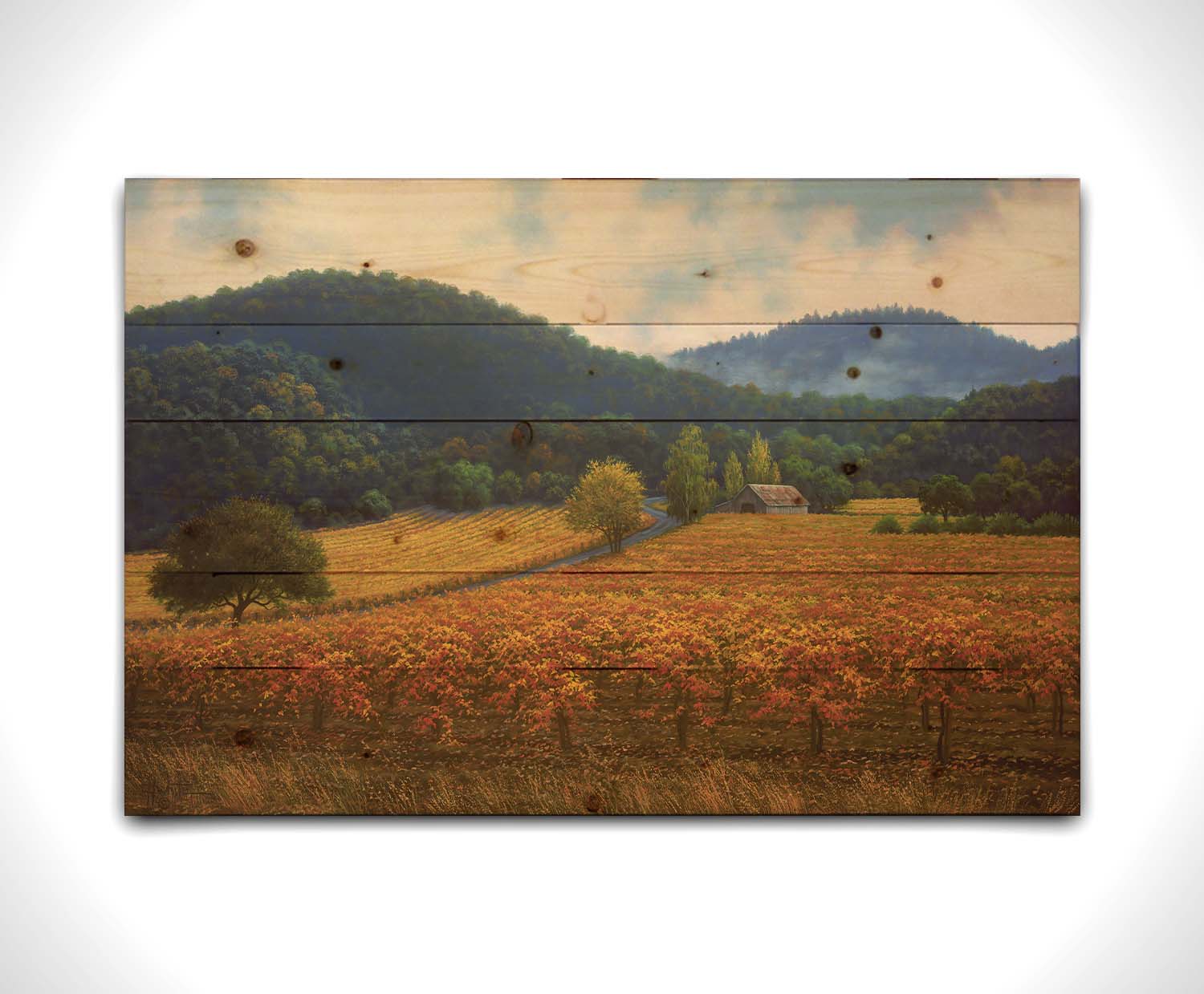 A painting of expansive vineyard fields, turned yellow, red, and orange for the fall. Rolling hills of forests fill the background. Printed on a wood pallet.