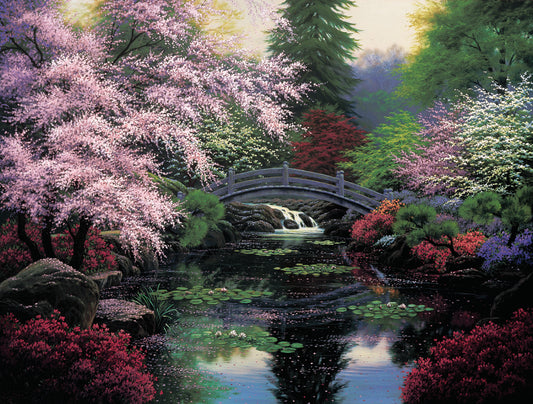 A painting of a tranquil pond surrounded by pink, red, and green flowered trees and shrubs. Lilly pads and fallen pink blossoms float on the water, which is crossed by a wooden bridge. 