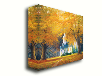 A painting of a white church in a forest of yellow and orange trees. Deer roam in the leaf-coated yard, and sun beams shine through the trees to highlight the building. Printed on canvas.