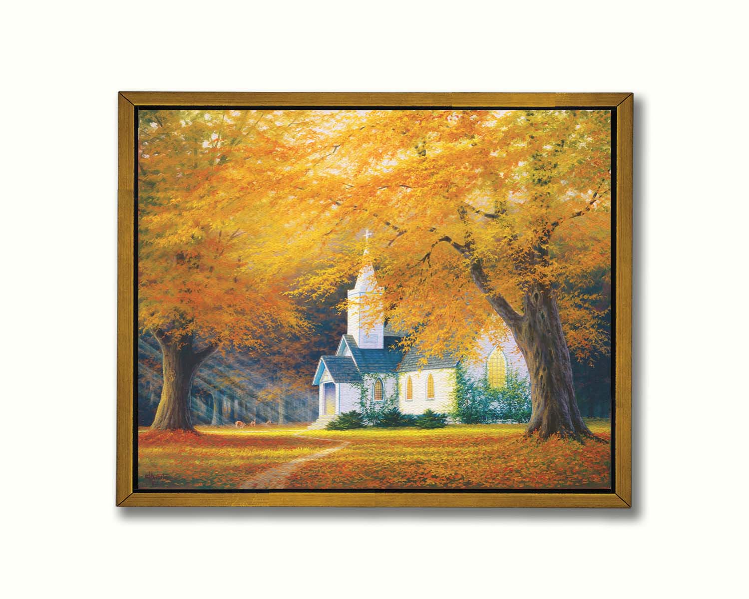 A painting of a white church in a forest of yellow and orange trees. Deer roam in the leaf-coated yard, and sun beams shine through the trees to highlight the building. Printed on canvas in a float frame.