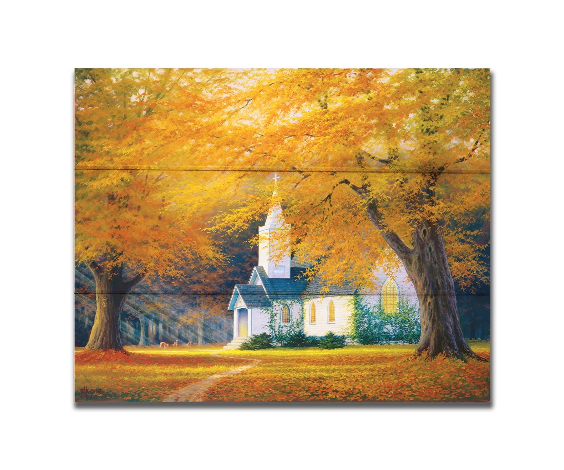 A painting of a white church in a forest of yellow and orange trees. Deer roam in the leaf-coated yard, and sun beams shine through the trees to highlight the building. Printed on a box board.